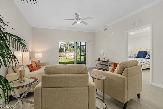 living room with ceiling fan and crown molding