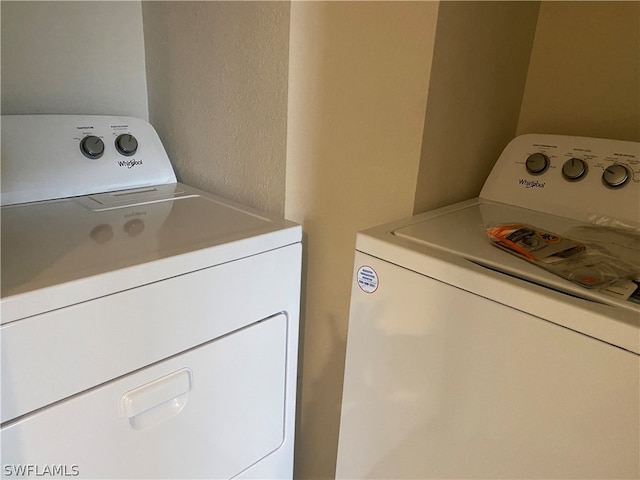 laundry room with washer and clothes dryer