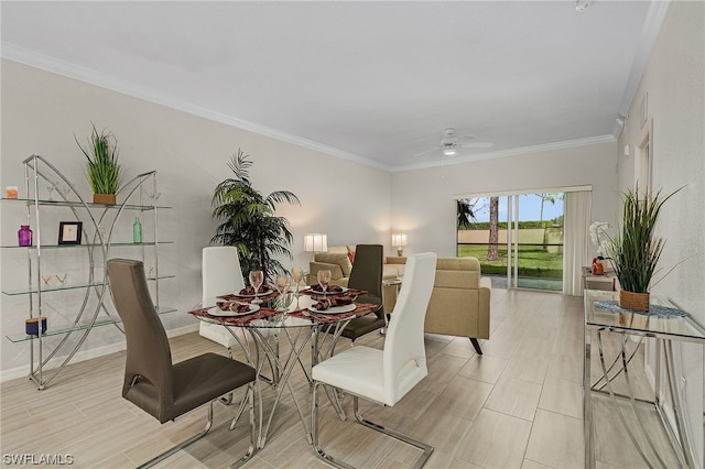 dining area with ceiling fan and crown molding