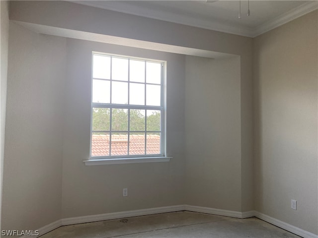 empty room with crown molding, ceiling fan, and a wealth of natural light