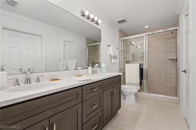 bathroom with toilet, an enclosed shower, ornamental molding, dual vanity, and tile flooring