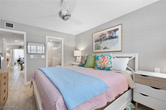 bedroom with light wood-type flooring, ensuite bath, and ceiling fan