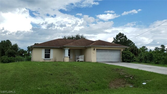 ranch-style home with a front lawn and a garage