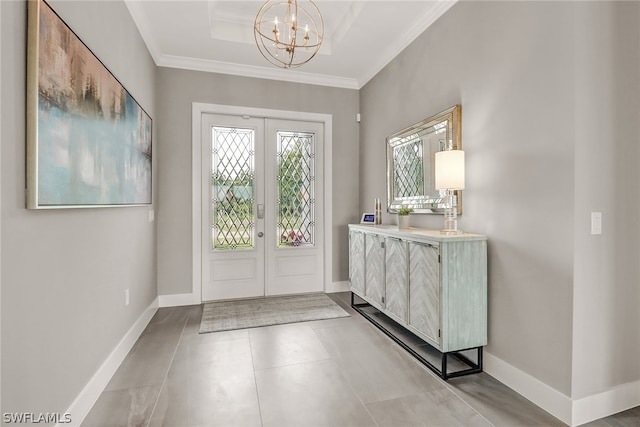 entryway featuring light tile floors, a notable chandelier, french doors, and a raised ceiling