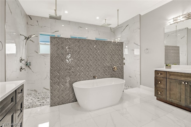 bathroom with vanity, tile floors, tiled shower, and tile walls