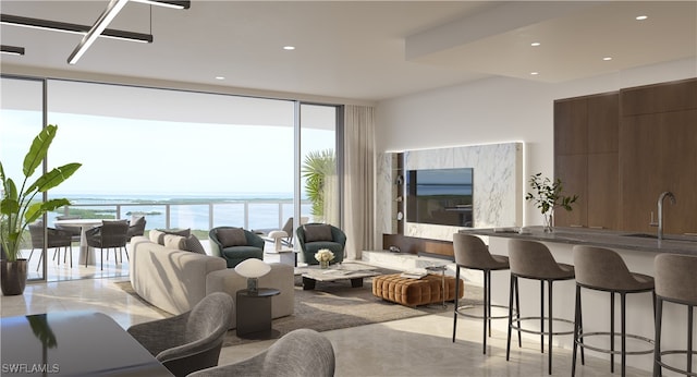 living room featuring a water view and a wall of windows