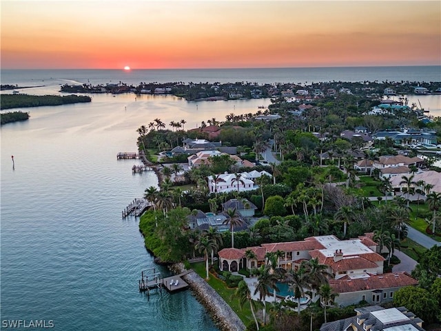 aerial view at dusk with a water view