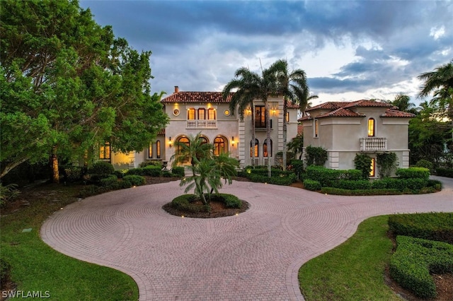 mediterranean / spanish home featuring a balcony