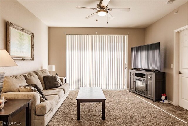 living room featuring carpet and ceiling fan