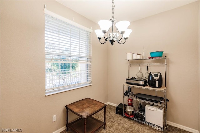 misc room with carpet flooring and a chandelier