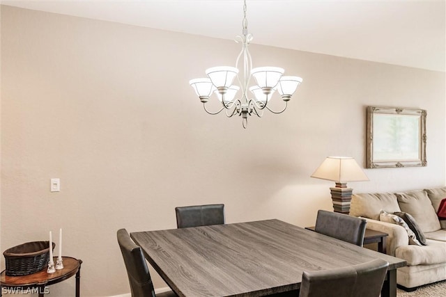 dining space with a notable chandelier