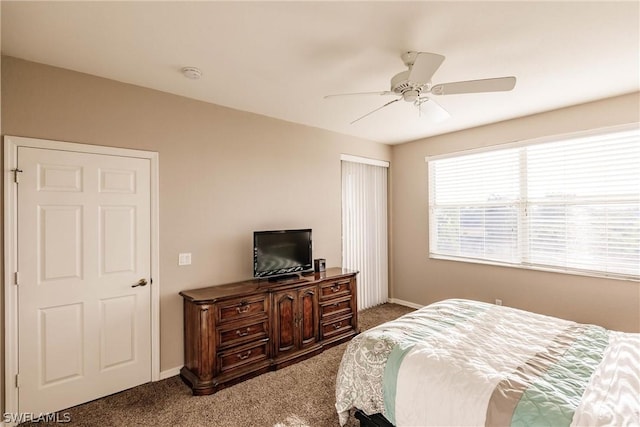 bedroom with dark carpet and ceiling fan