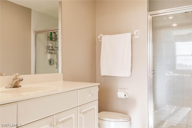 bathroom with walk in shower, toilet, and vanity