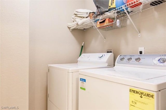 laundry area with separate washer and dryer