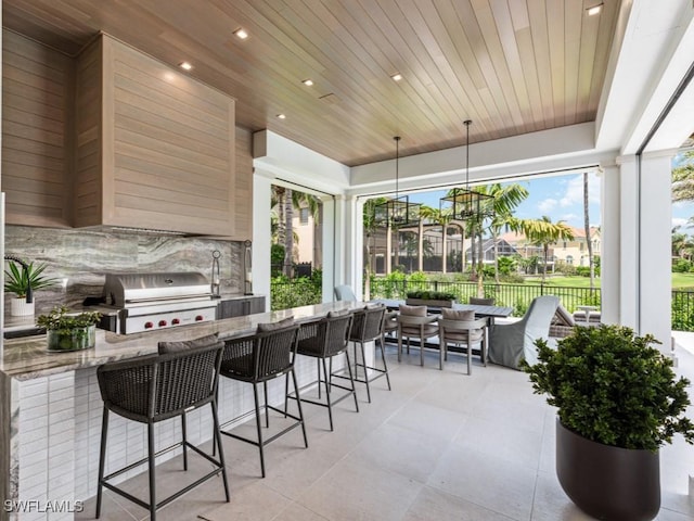 sunroom featuring wood ceiling