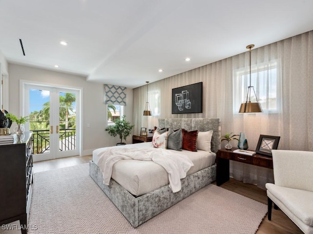 bedroom with access to exterior, recessed lighting, french doors, and light wood-style flooring