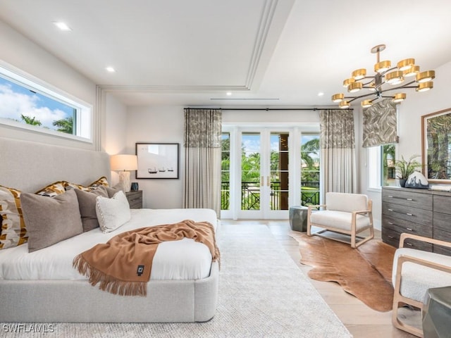 bedroom featuring access to outside, multiple windows, a chandelier, and recessed lighting