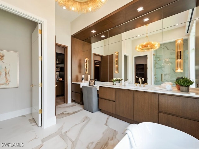 full bathroom with marble finish floor, baseboards, a stall shower, and vanity
