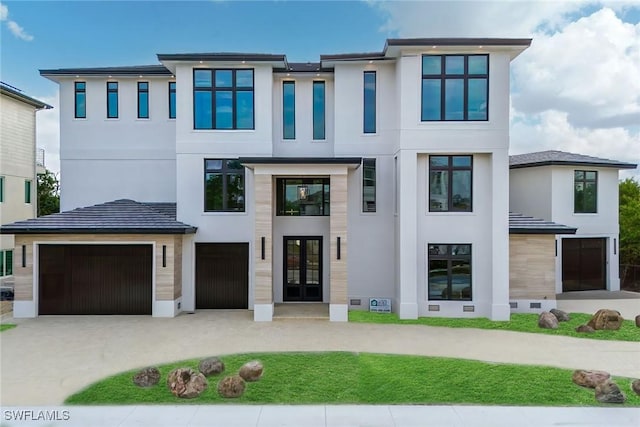 view of front of home featuring a garage and french doors