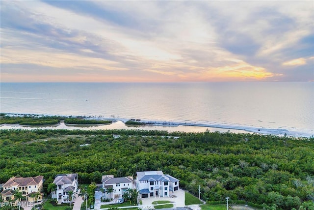 aerial view at dusk with a water view