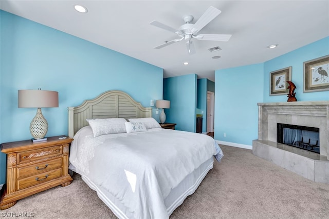 bedroom with light carpet and ceiling fan