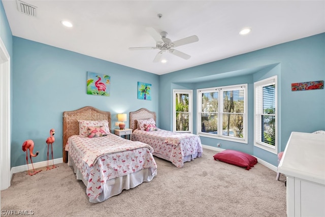 carpeted bedroom with ceiling fan