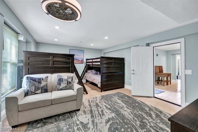 bedroom with light tile floors and multiple windows