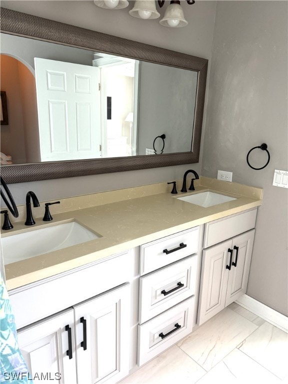 bathroom with tile floors and dual vanity