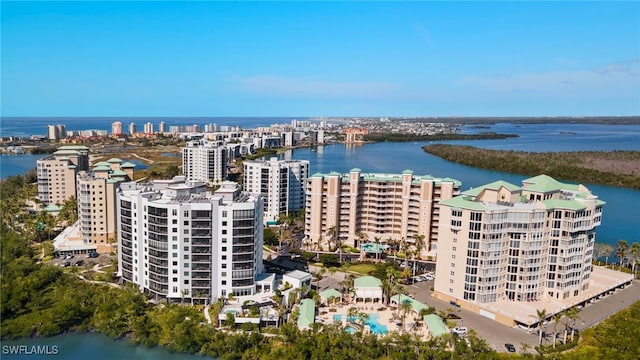 birds eye view of property featuring a view of city and a water view