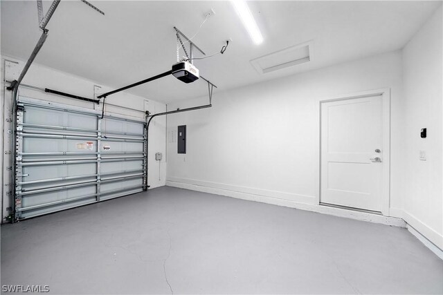 garage with electric panel and a garage door opener