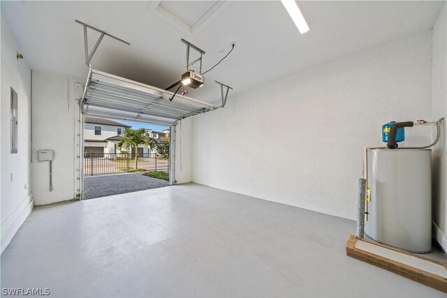 garage with electric panel, gas water heater, and a garage door opener