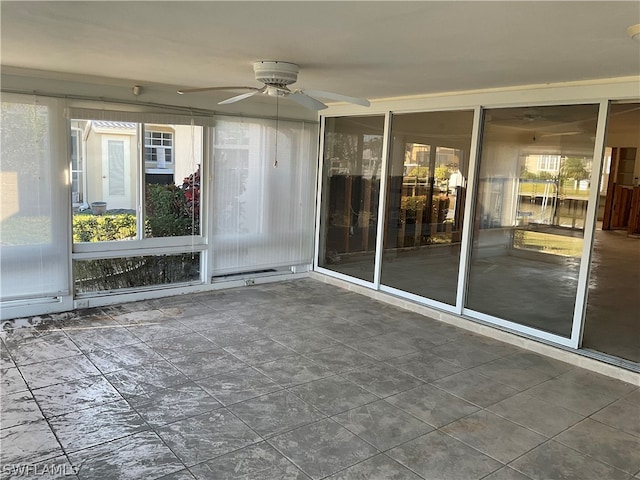 interior space featuring a healthy amount of sunlight and ceiling fan