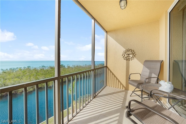 balcony featuring a water view