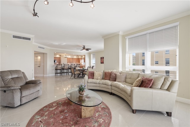 living room featuring ceiling fan, ornamental molding, and light tile patterned floors