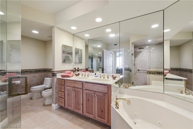 bathroom featuring a bidet, a whirlpool tub, a shower stall, tile walls, and toilet