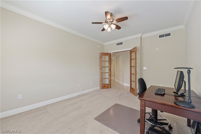 carpeted home office with ceiling fan, ornamental molding, and french doors