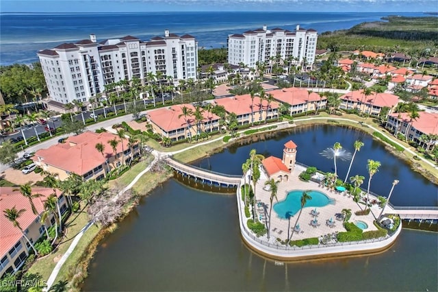 drone / aerial view featuring a water view and a city view