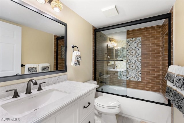 full bathroom with vanity, toilet, and enclosed tub / shower combo