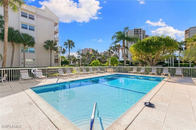 view of swimming pool with a patio area