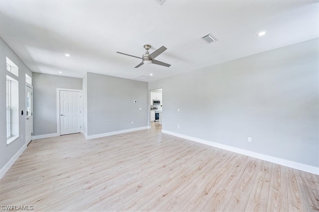 unfurnished room featuring light hardwood / wood-style flooring and ceiling fan