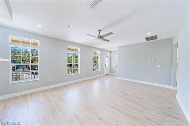 unfurnished room with light hardwood / wood-style flooring and ceiling fan