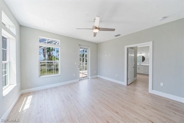 spare room with ceiling fan and light hardwood / wood-style floors