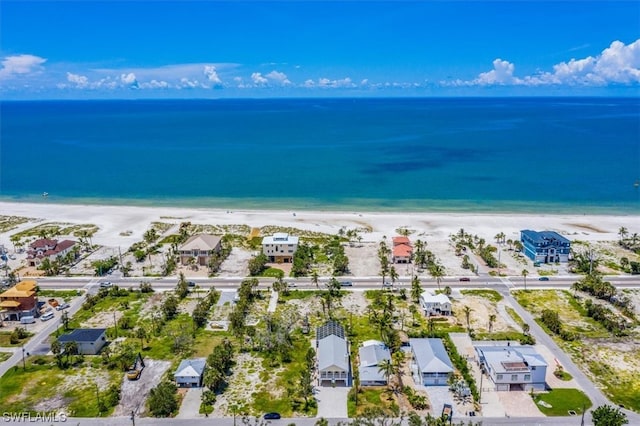 bird's eye view featuring a view of the beach and a water view