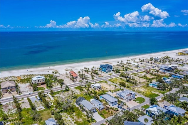 drone / aerial view with a view of the beach and a water view