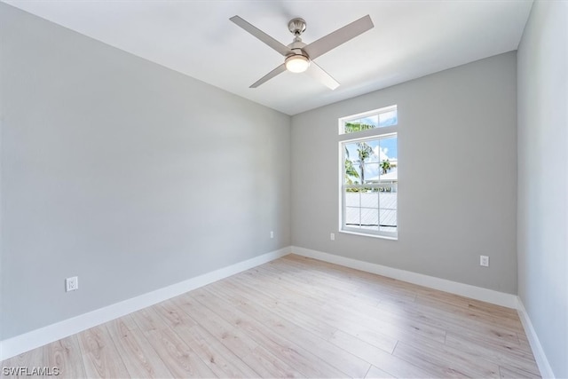 empty room featuring ceiling fan and light hardwood / wood-style flooring