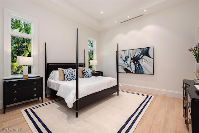 bedroom featuring recessed lighting, visible vents, baseboards, and light wood finished floors