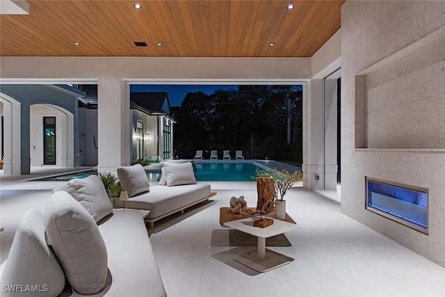view of patio / terrace with an outdoor pool and outdoor lounge area