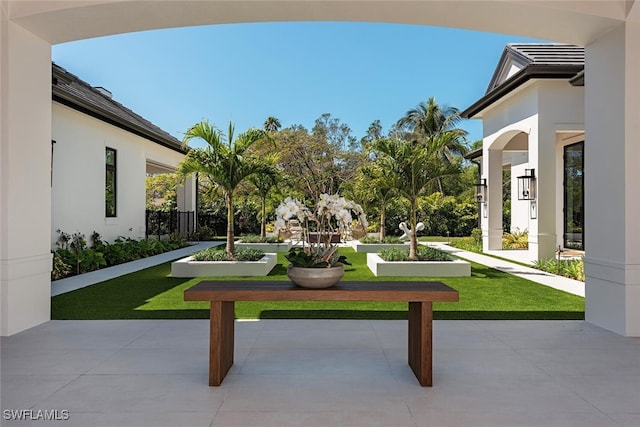 view of home's community with a lawn