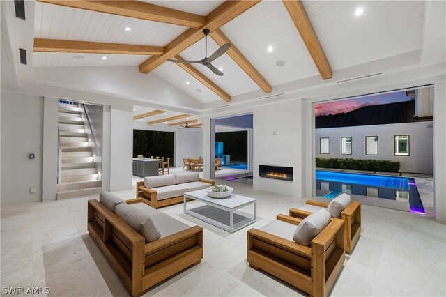 living room with beamed ceiling, high vaulted ceiling, and ceiling fan