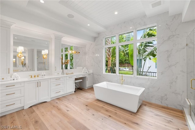 bathroom featuring independent shower and bath, wood-type flooring, vanity, wood ceiling, and tile walls